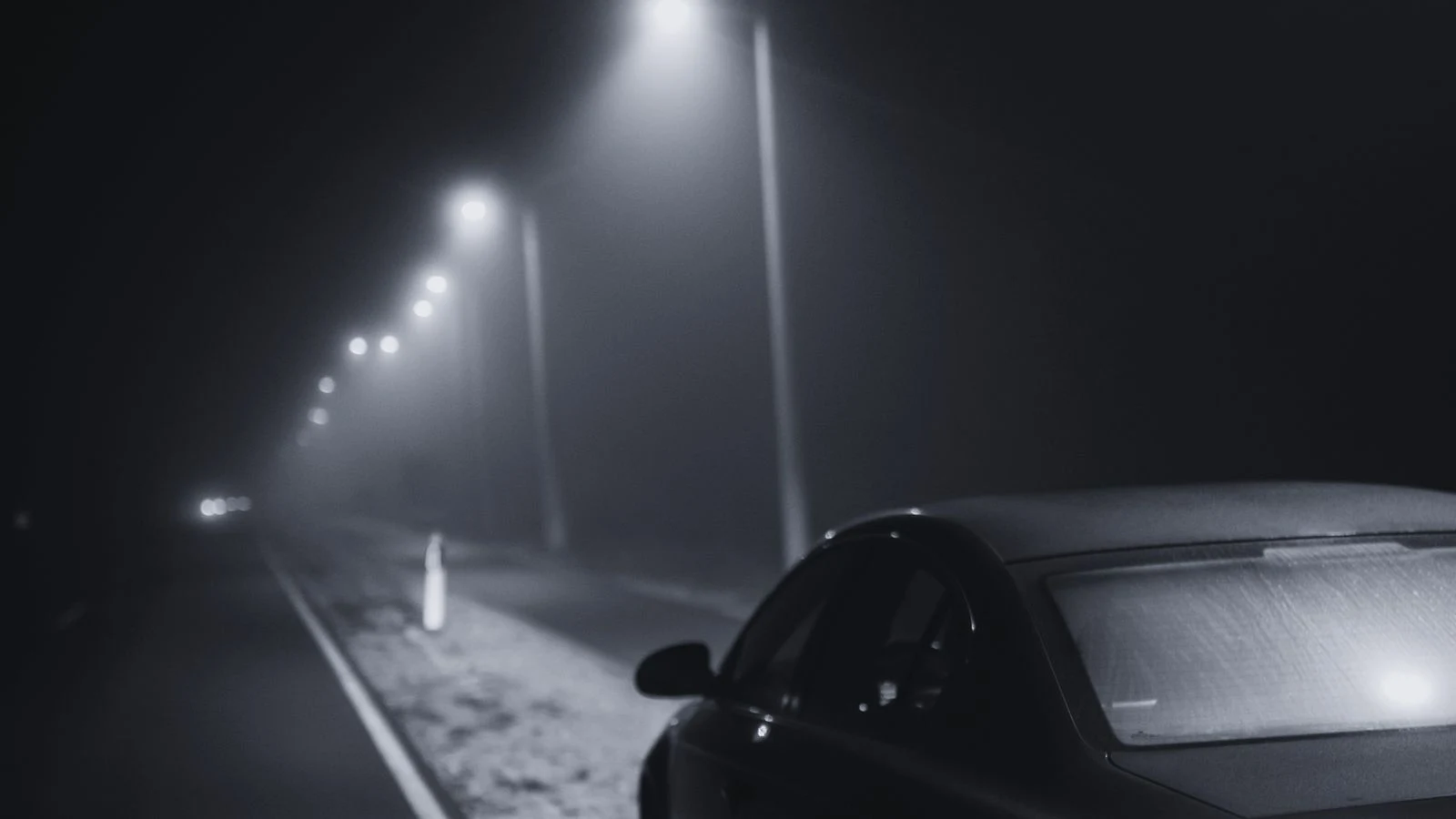 The Highway That Hunts — Scene 6: The Phantom Car Waiting Beneath the Streetlight at 3:03 AM - The Highway That Hunts Horror Movie Scene Still 4K Wallpaper